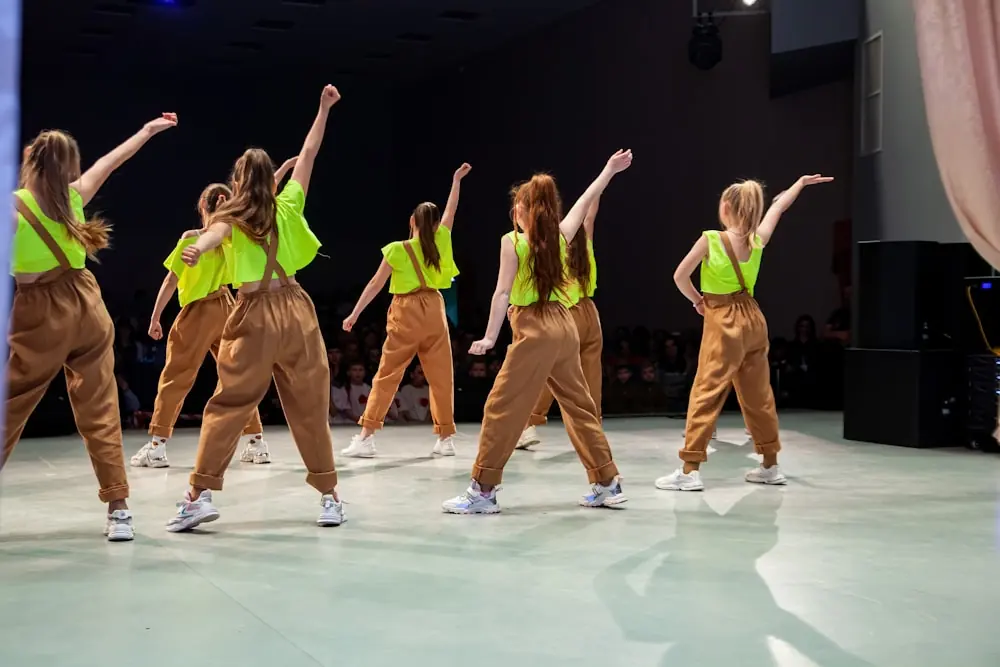The teens group finishing a routine in high-vis vests.